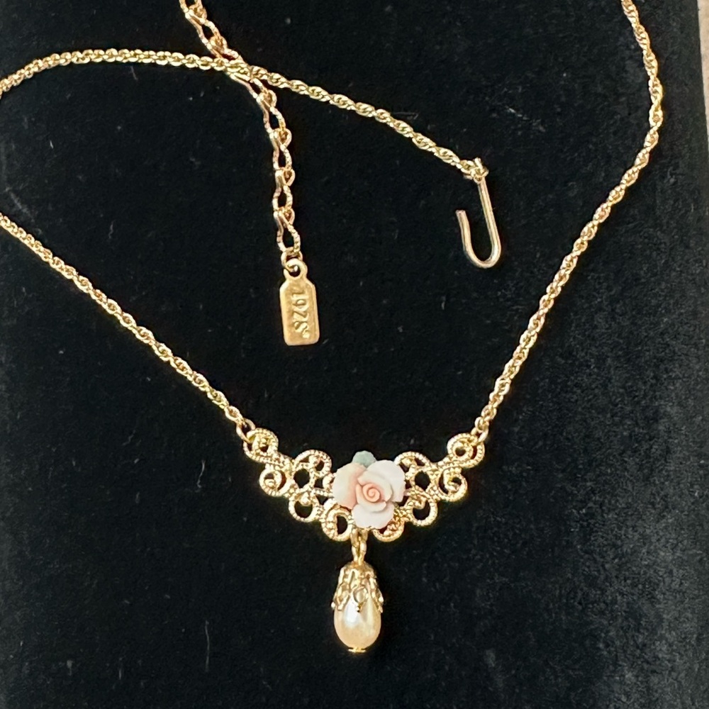 1928 Gold Tone Floral Drop Necklace with Pink Porcelain Rose Accent